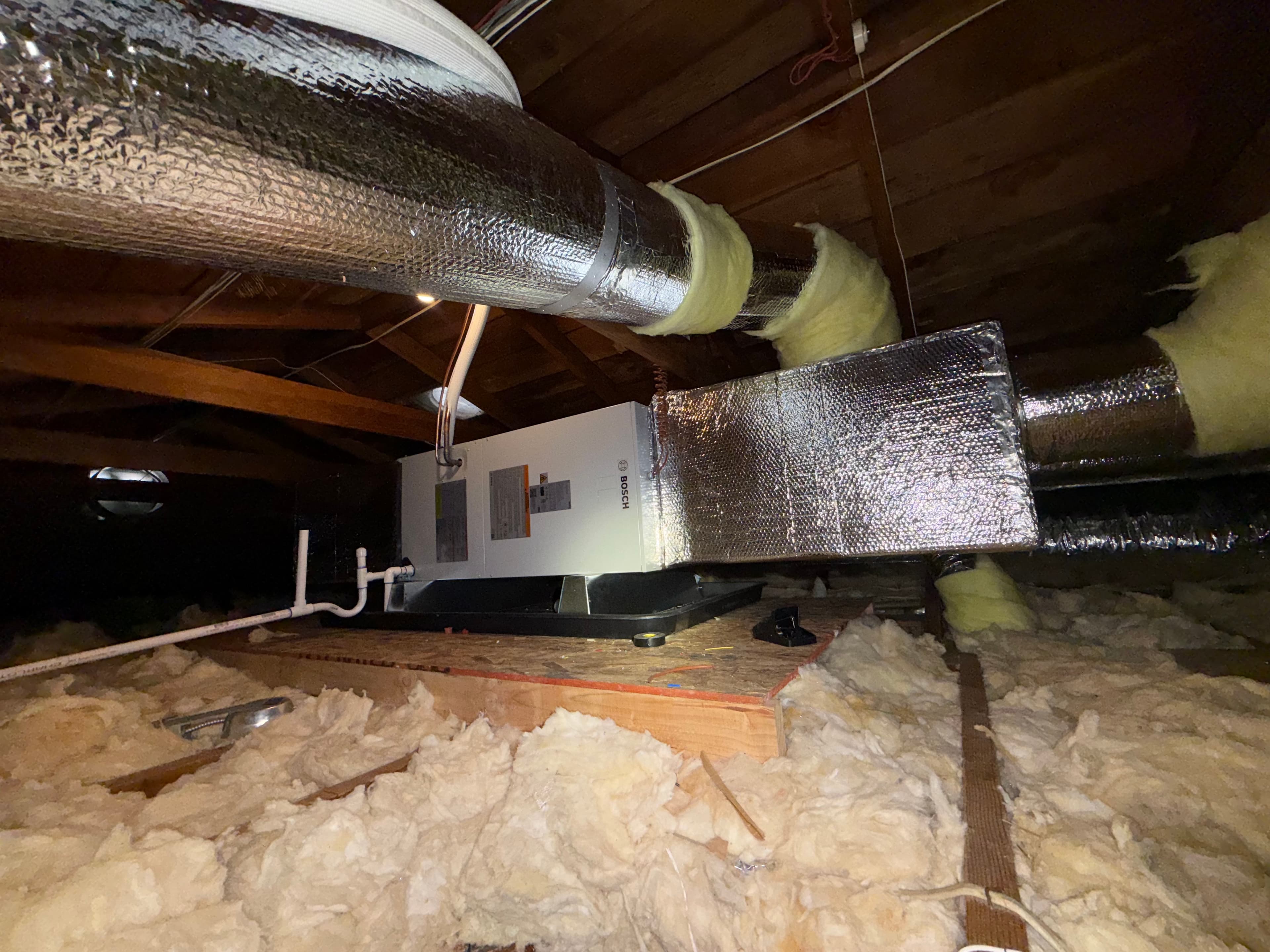 HVAC unit with ductwork in crawlspace